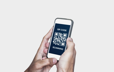 QR code scanning payment and verification. Hand using mobile smart phone scan QR code, isolated