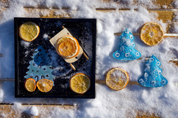 Merry Christmas and  New Year flat lay with  Christmas tree, toy sled  and dry orange