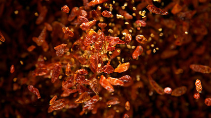 Dried chilli spice flying in the air.