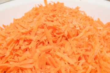 background grated carrots. carrots close-up. finely grated carrots. texture of carrots.