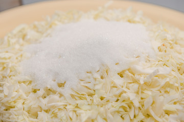 sliced cabbage background. cabbage salad. cut cabbage into small pieces. seasoning on a salad. pickle cabbage.