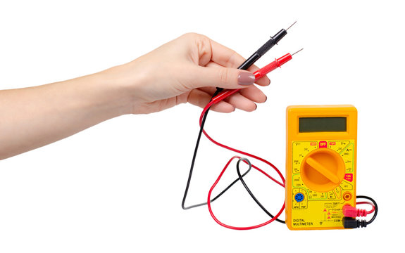Yellow plastic multimeter, electric tester tool. Isolated on white.