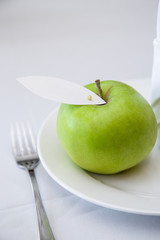 green apple on a plate