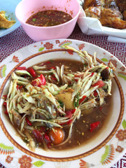 Papaya salad for Thai dinner in local market stall