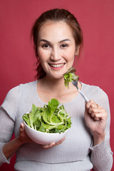 Healthy Asian woman with salad.