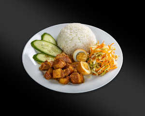 Thit Kho - pork stewed in caramel sauce with boiled egg.