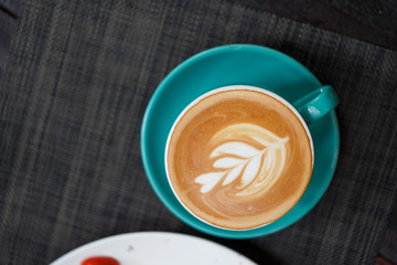 A cup of Coffee Latte on the table.