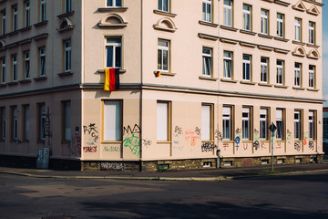german national flag hanging outside window of an apartment building in Leipzig, Germany