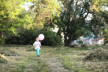 Little children are walking in a park