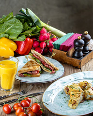 breakfast: chicken sandwich and omelet with asparagus