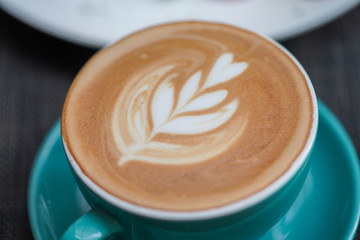 A cup of Coffee Latte on the table.