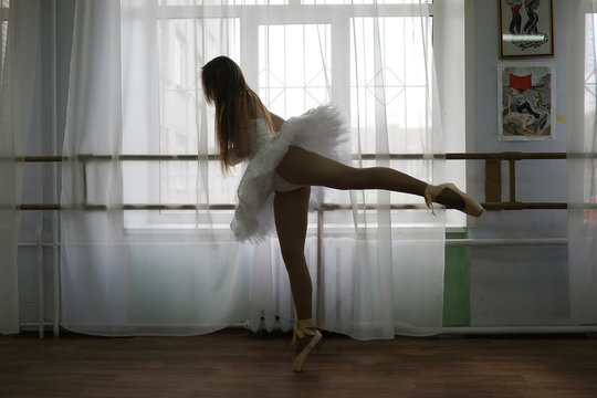 Pretty girl ballet dancer practicing - Powered by Adobe