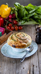hot dishes cooked in the oven. Greek veal, stewed sour cream rabbit, veal roast