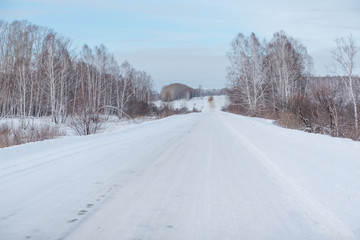 Fototapeta premium Winter road. Ride through the winter forest. Snow fell in the forest. Road through the snow.