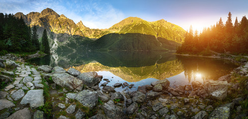 Amazing panoramic view  of a mountain lake  Morskie Oko in morning. Tatra National Park. Poland. Europe. Mountain hiking. Concept of journey, travel lifestyle, harmony with nature. - obrazy, fototapety, plakaty
