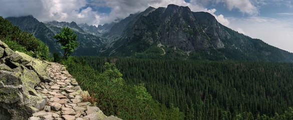 Naklejka na ściany i meble Panoramic view of mountains stone trail to The Popradske pleso lake in High Tatras National Park. Slovakia. Europe. Mountain hiking. Concept of journey, travel lifestyle, harmony with nature.