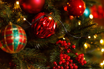 Obraz na płótnie Canvas Beautiful Red Christmas Balls Hanged On The Christmas Tree Branch