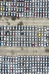 View from above, stunning aerial view of a parking lot full of brand new cars ready to be exported and sold. Singapore. Singapore is an island city-state off southern Malaysia.