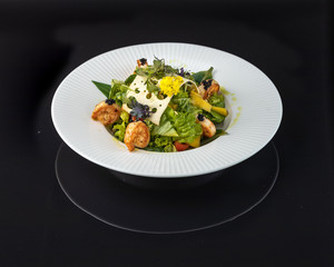 Tiger Shrimp and Mango Salad Mango, cashew, peanuts, tiger prawns, Romano salad, soy sauce, orange, cherry
