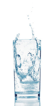 one glass of water with splash from falling ice cube, white background, isolated object