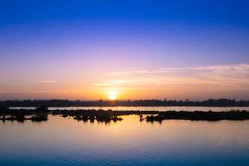 Naklejka na ściany i meble Nile sunset, view from cruise boat