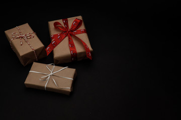 New year eve flatlay. Christmas tree and decorations. 2020. Merry Christmas mood. Celebration. Black background.  Gifts. Presents. Winter holiday. Mockup. Copy space for text. Xmas.