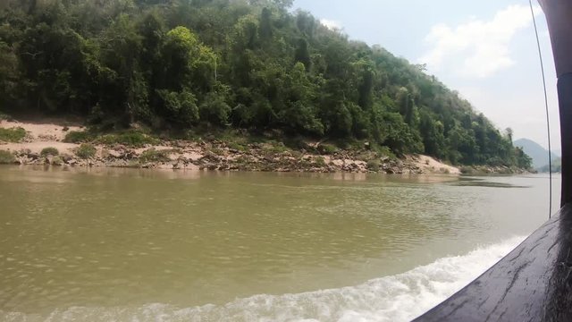 Timelapse of a Slowboat on the Mekong River in Laos during Sunny Weather