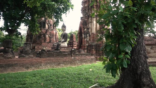 Slowmotion shot of Buddhist Statue in Ayutthaya Old Ruins