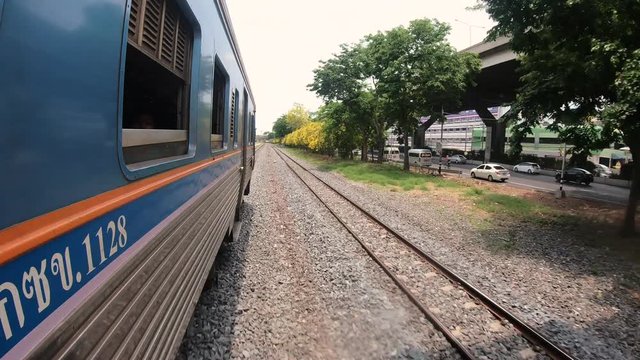GoPro shot from Outside a Thai Train Travelling outside of Bangkok