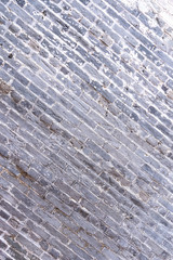 Real gray antique retro brick tone, pattern wall background in an old chinese house, close up, flat lay, top front view.