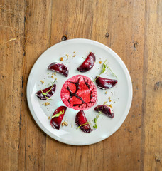 Baked beetroot carpaccio with pear and nuts.