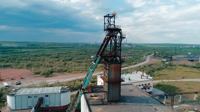 Coal mine with a shaft-head in the middle of the vast expanses of Russia. Copter ( drone ) shooting