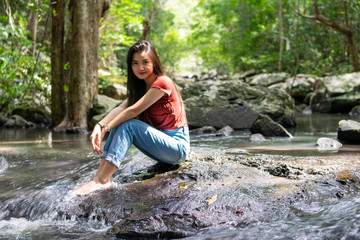 portrait tourist girl in beautiful water fall