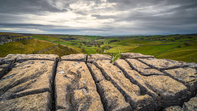 Malham Village below Malham Cove, in Malhamdale which has extensive Limestone Pavement at the top where the Pennine Way passes by