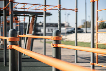 public city orange vertical and horizontal bars for healthy sport exercise in the morning