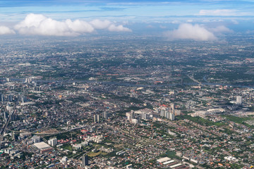 Aerial view of Bangkok city from airplane window.