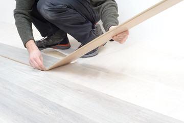 man reading book on floor