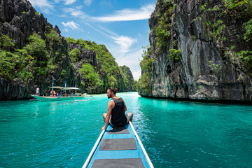 Palawan, Philippines, Traveler on Boat Deck Exploring Natural Sights Around El Nido