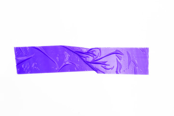 purple tapes on white background. Torn horizontal and different size violet sticky tape, adhesive pieces.