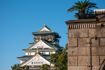 Osaka Castle in Osaka with autumn leaves. Japan Travel Concept