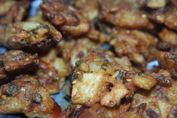 close-up view with selective focus of crispy basin pakora/pakoda or patties