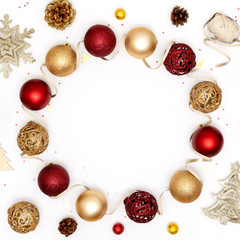 Naklejka na ściany i meble New Year and Christmas frame. Red and golden Christmas decorations - shiny balls, stars, pine cones and decorative ribbon on white paper background. Top view, flat lay, copy space