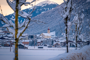 Winter morning cityscape in the Austrian town of Neustift.
