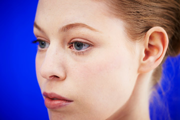 Caucasian woman on blue background 