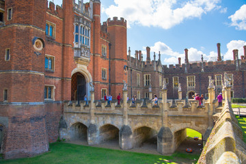 London, UK. English architecture Tudors time, West Front of Hampton court with entrance gate,...