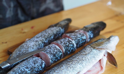 Shuka river fish on a cutting table in the village