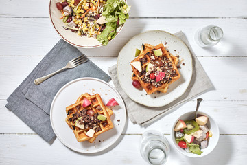 Homemade waffles with fruit and granola..