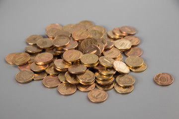 a pile of coins on a gray background