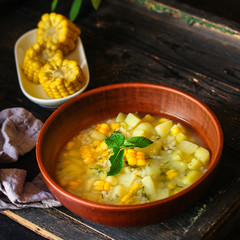 soup with corn and vegetables (first course, vegetarian dish) menu concept. food background. copy space. Top view