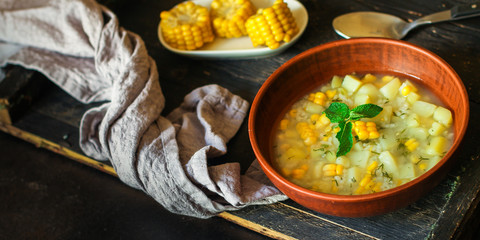 soup with corn and vegetables (first course, vegetarian dish) menu concept. food background. copy space. Top view